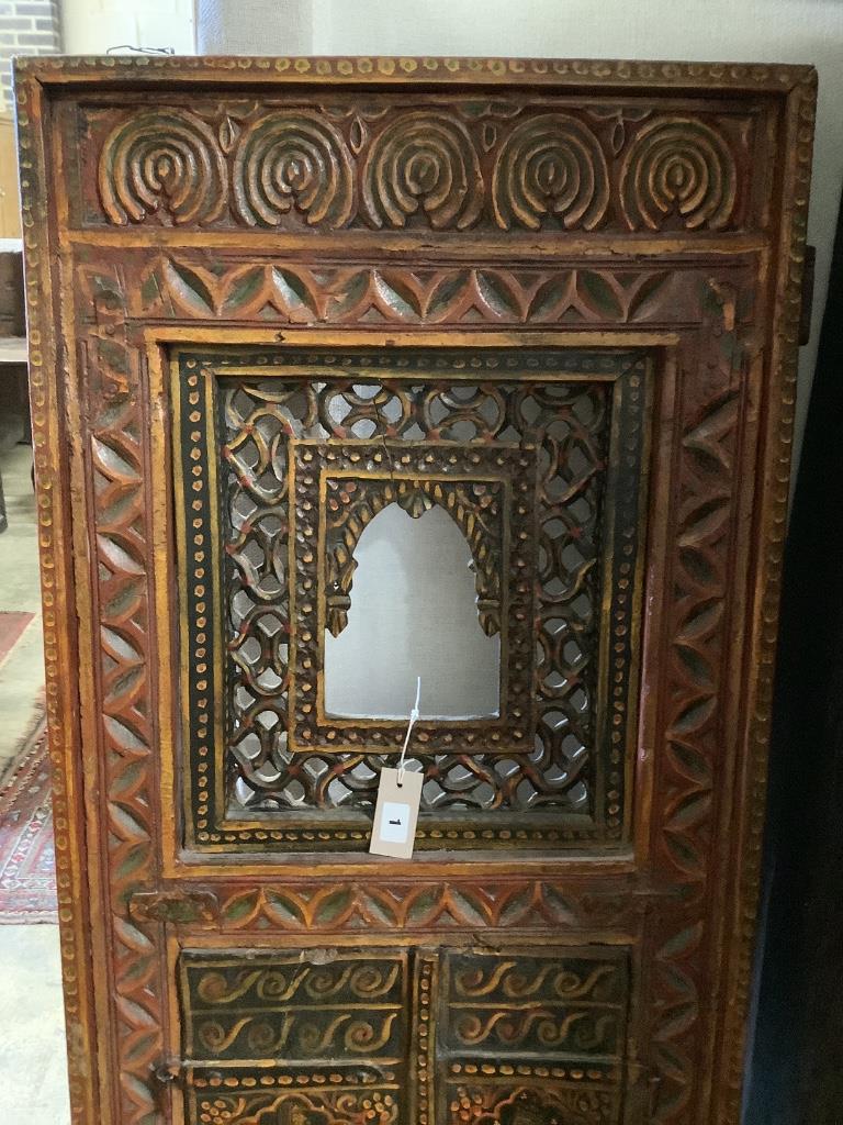 An Indian carved gilt painted panel, width 60cm height 170cm